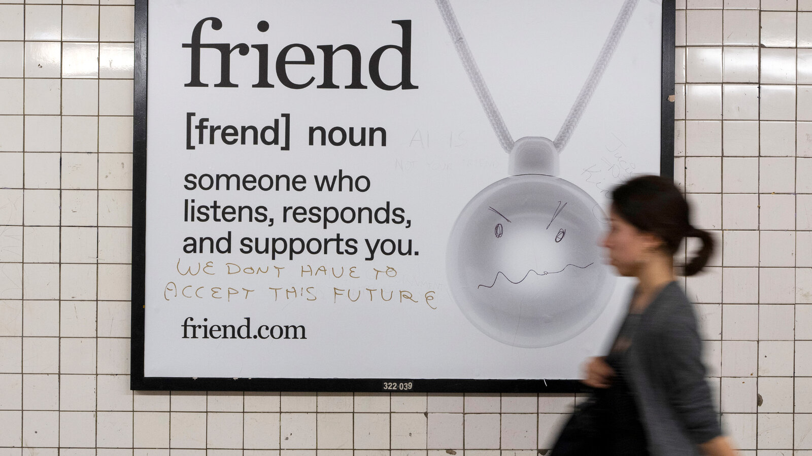 Subway advertisement for Friend.com, vandalized with the words "We don't have to accept this future".